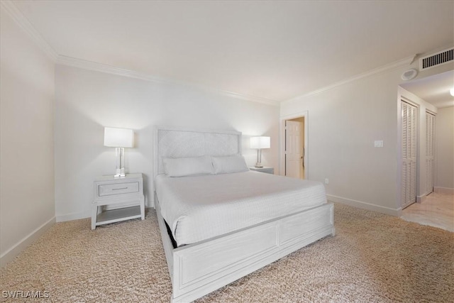 bedroom featuring crown molding and carpet flooring