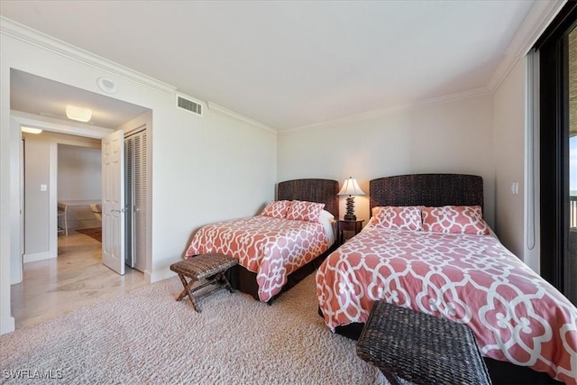 bedroom featuring a closet and ornamental molding