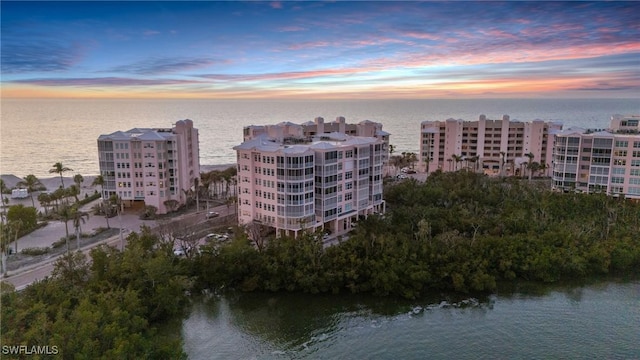 aerial view at dusk with a water view