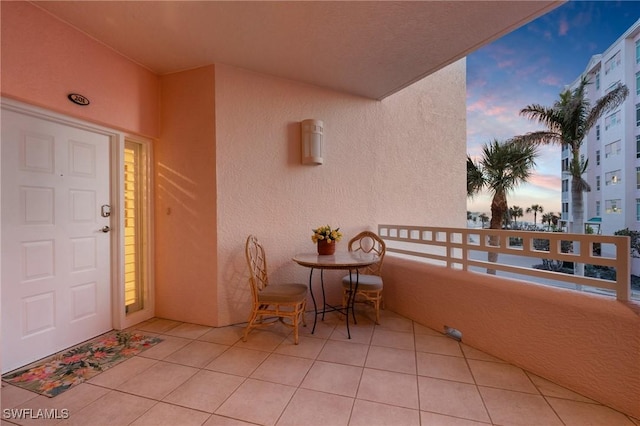 view of balcony at dusk