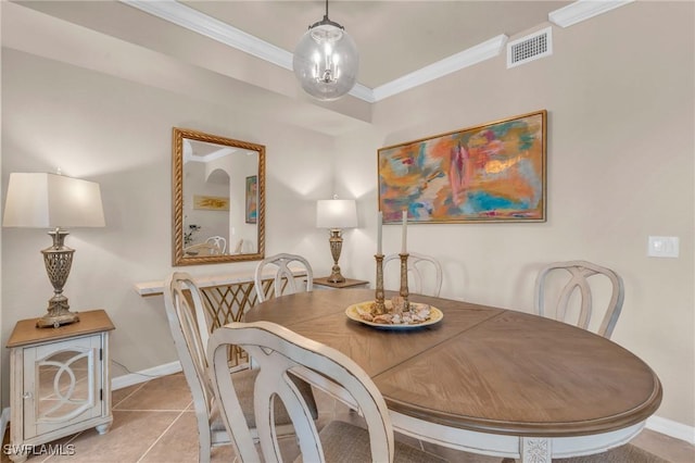 tiled dining area with crown molding