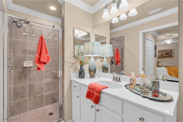 bathroom with vanity, ornamental molding, and an enclosed shower