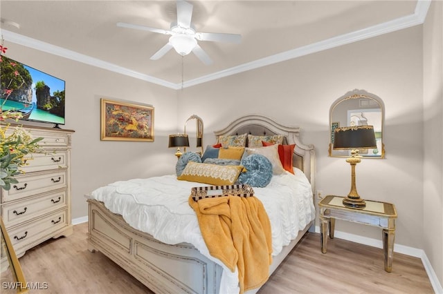 bedroom featuring crown molding, ceiling fan, and light wood-type flooring