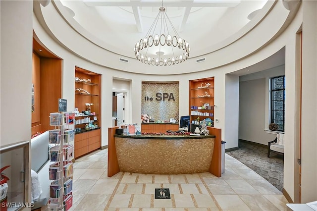 welcome area featuring a notable chandelier