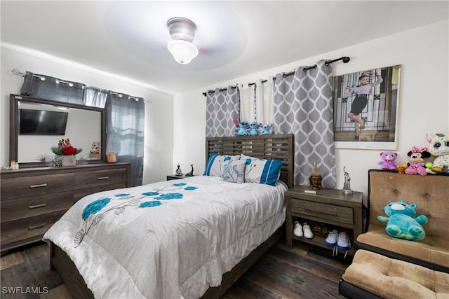 bedroom featuring ceiling fan and dark wood-type flooring