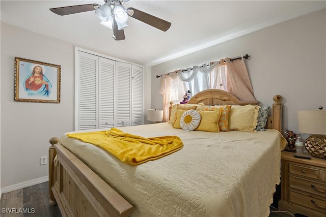 bedroom with ceiling fan, a closet, and dark hardwood / wood-style flooring