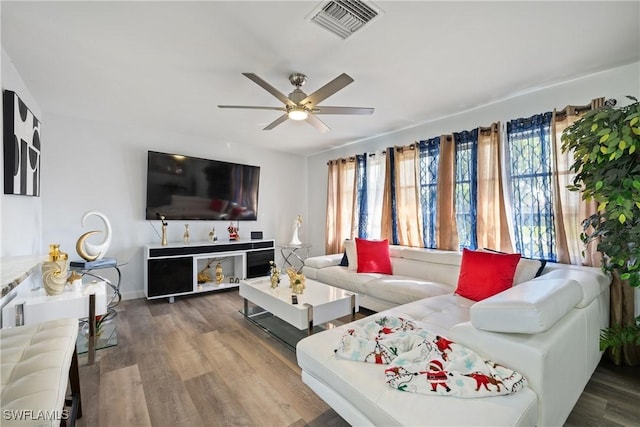 living room with ceiling fan and hardwood / wood-style floors