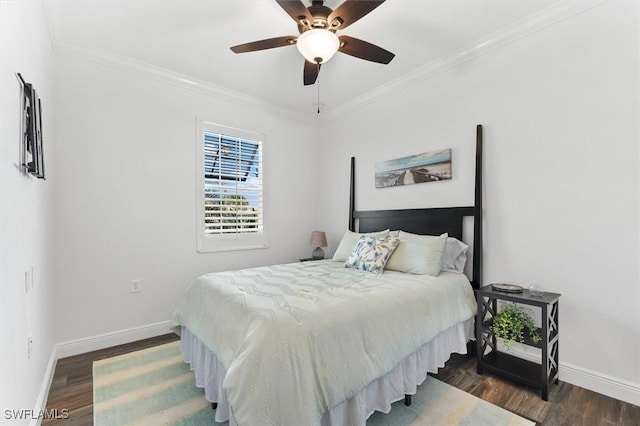 bedroom with crown molding, dark hardwood / wood-style floors, and ceiling fan