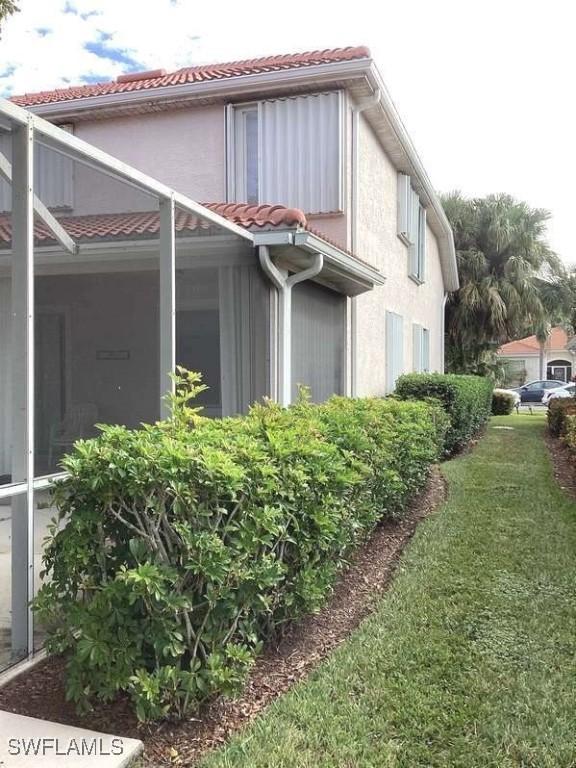 view of home's exterior featuring a lawn