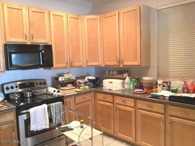 kitchen with stainless steel range with electric cooktop and light brown cabinets