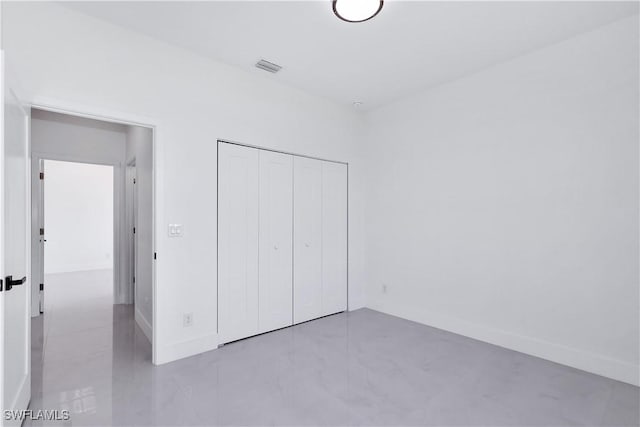 unfurnished bedroom with a closet