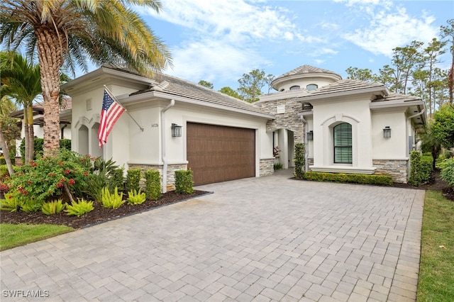 mediterranean / spanish-style house featuring a garage