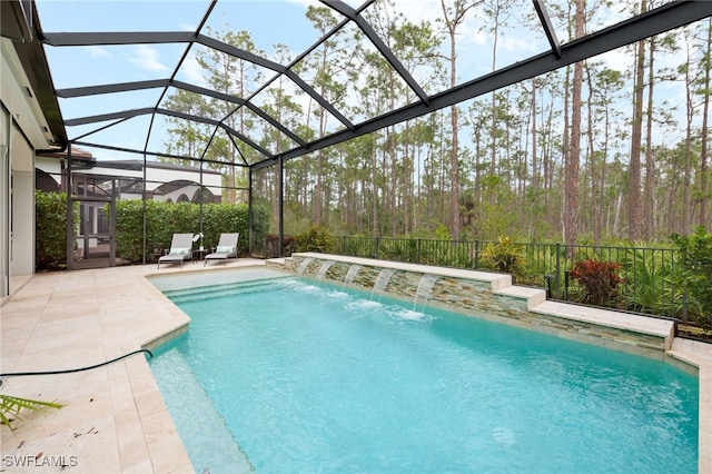 view of swimming pool with a patio area, pool water feature, and glass enclosure