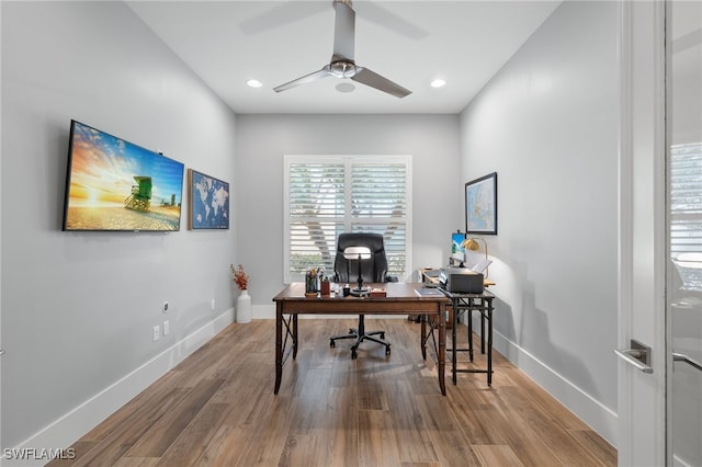 office area featuring wood-type flooring and ceiling fan