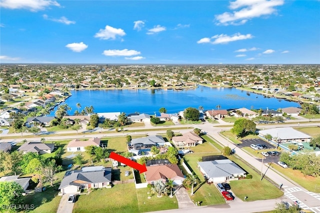 birds eye view of property with a water view