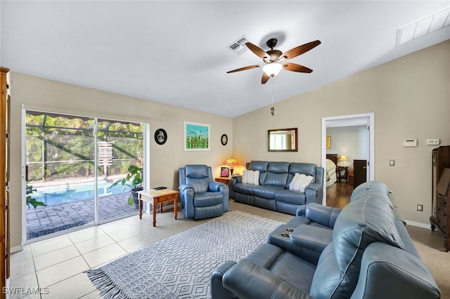 living room with light tile patterned floors, vaulted ceiling, and ceiling fan