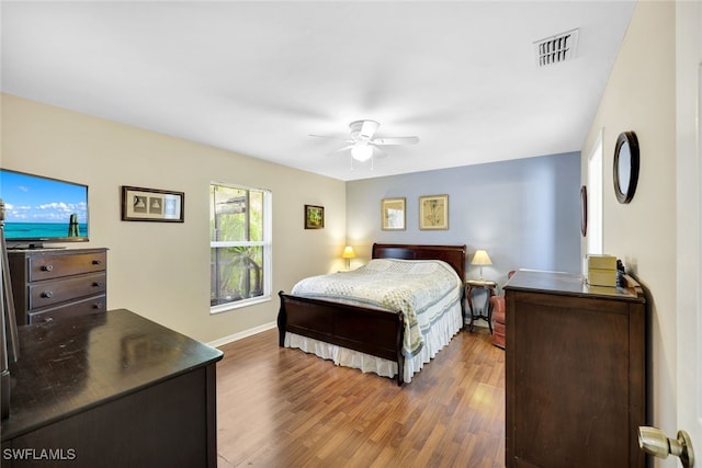 bedroom featuring ceiling fan and dark hardwood / wood-style flooring