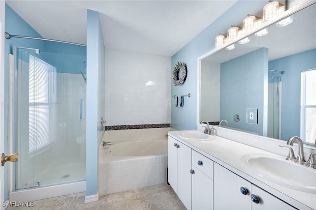 bathroom featuring vanity and shower with separate bathtub