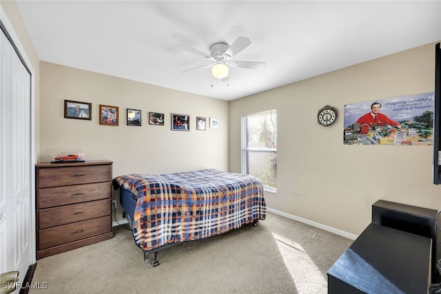 bedroom with light carpet, a closet, and ceiling fan