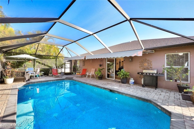 view of pool featuring a patio area, a lanai, and a grill