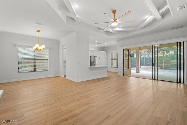 unfurnished living room featuring crown molding, coffered ceiling, ceiling fan with notable chandelier, and light hardwood / wood-style flooring