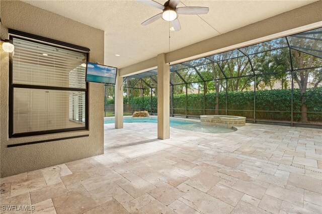 view of patio featuring a pool with hot tub and glass enclosure