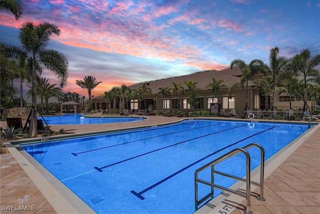 community pool with a gazebo