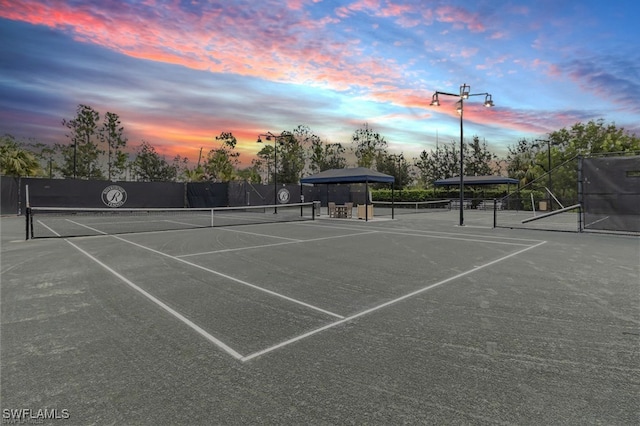 view of sport court with fence