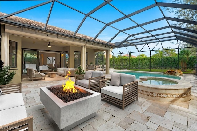 view of patio / terrace with a pool with connected hot tub and an outdoor living space