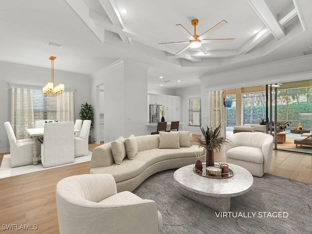 living area with beam ceiling, light wood finished floors, visible vents, ornamental molding, and coffered ceiling