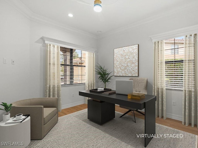 office area featuring ornamental molding, light wood-style flooring, and baseboards