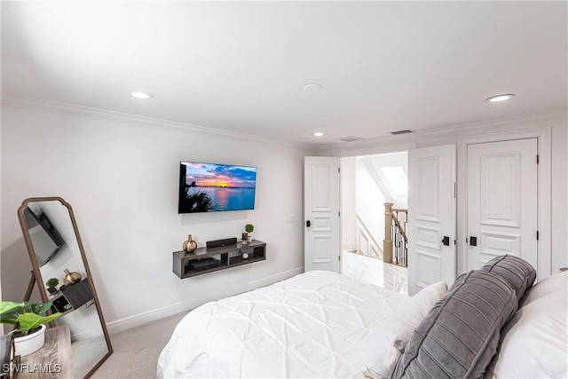 bedroom featuring crown molding and light carpet