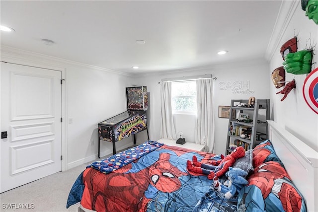 bedroom with crown molding and light colored carpet