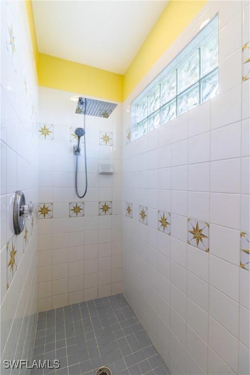 bathroom with tiled shower