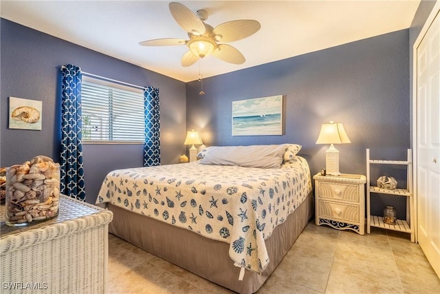 bedroom featuring ceiling fan and a closet