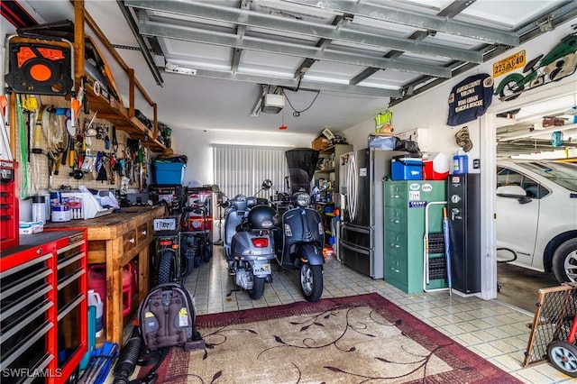 garage with a workshop area and a garage door opener