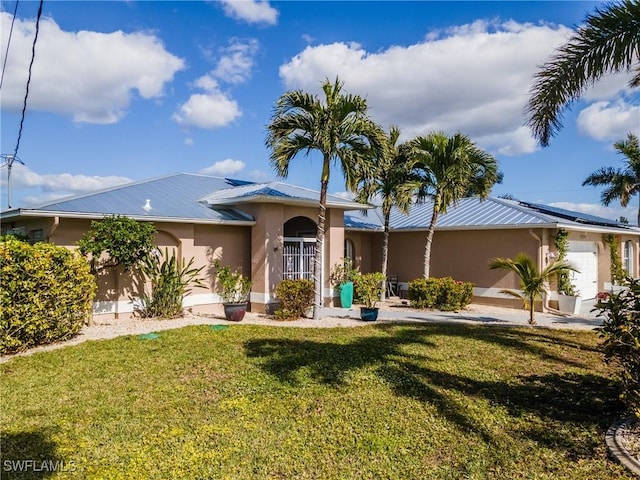 ranch-style house with a front lawn and a garage