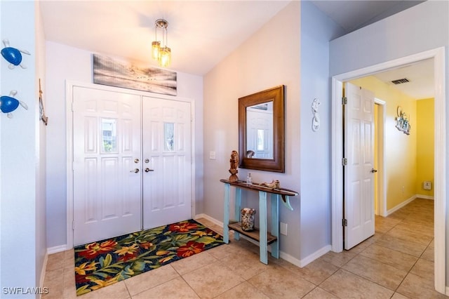 foyer entrance featuring light tile patterned floors