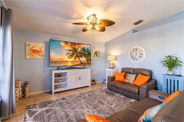 tiled living room featuring lofted ceiling and ceiling fan