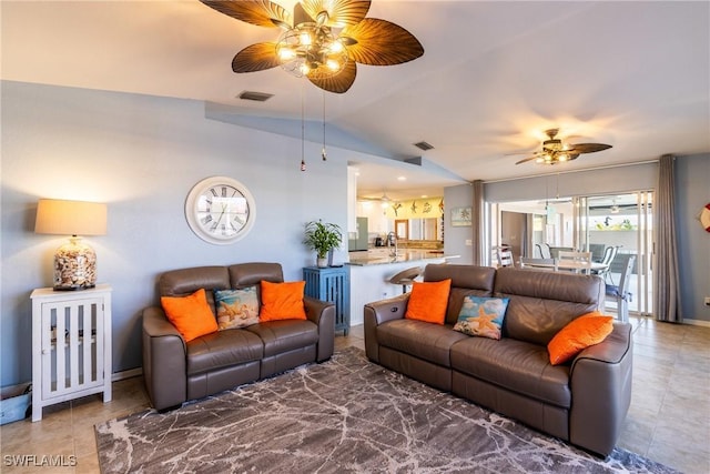 living room featuring ceiling fan and vaulted ceiling