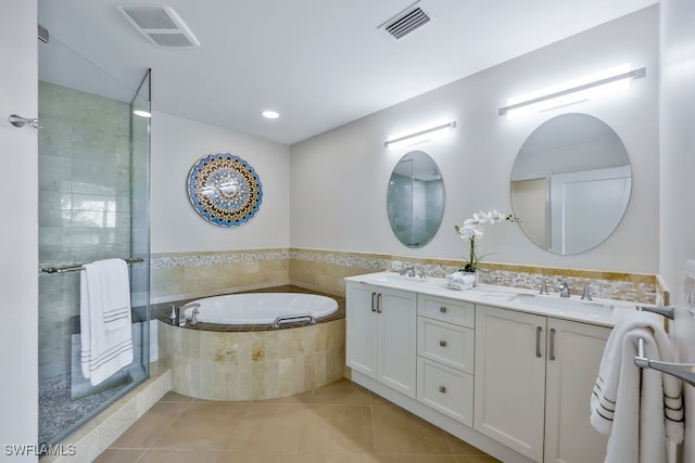 full bath with visible vents, a stall shower, a sink, tile patterned flooring, and a bath