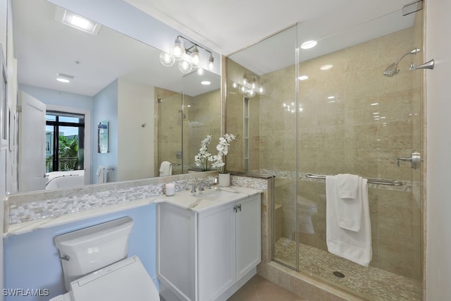 bathroom featuring ensuite bath, a stall shower, and vanity