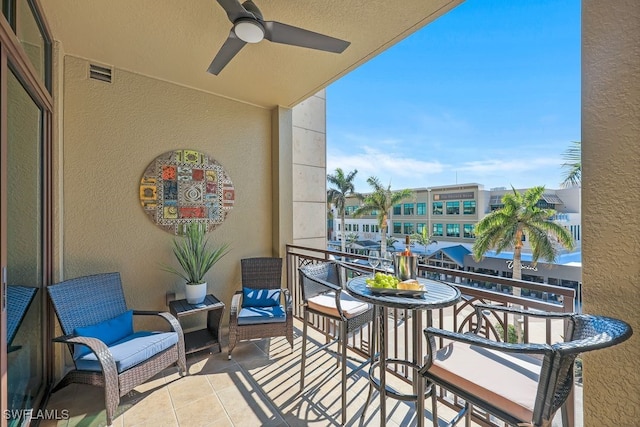 balcony with visible vents and ceiling fan