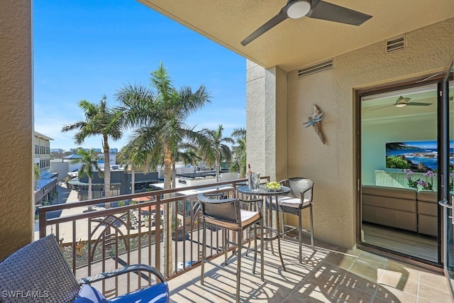 balcony with visible vents and ceiling fan