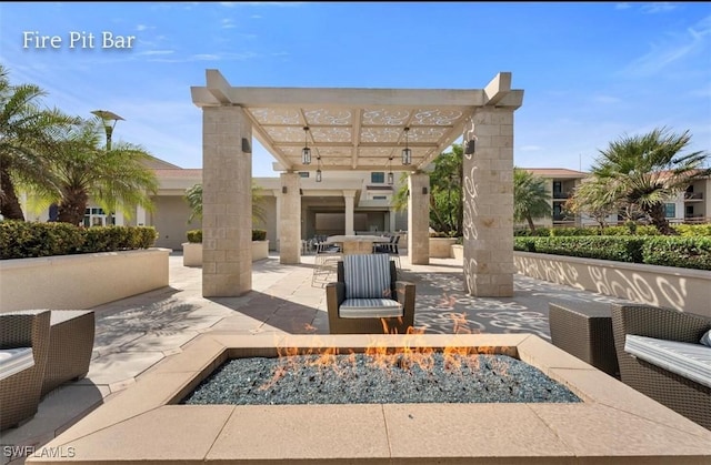 view of patio featuring an outdoor fire pit and a pergola