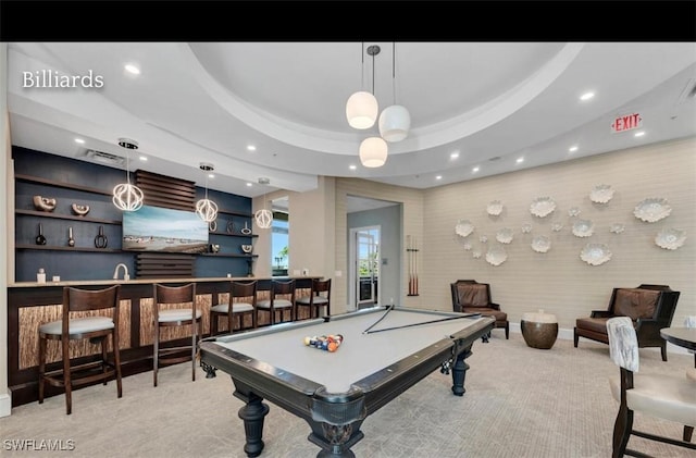 game room featuring light carpet, wet bar, a tray ceiling, and pool table