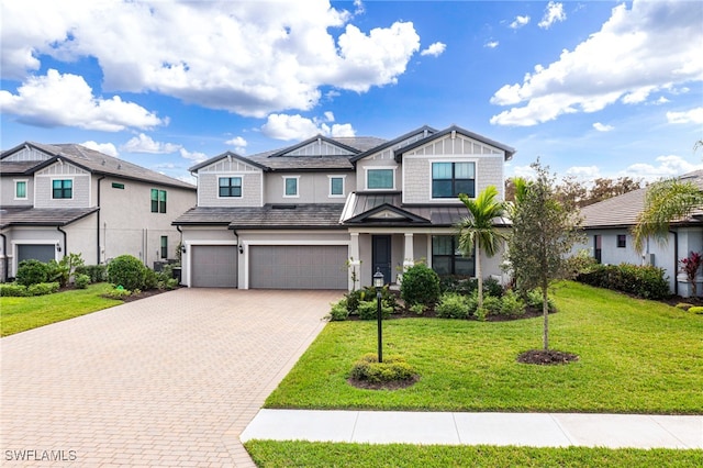 view of front of house featuring a garage and a front yard