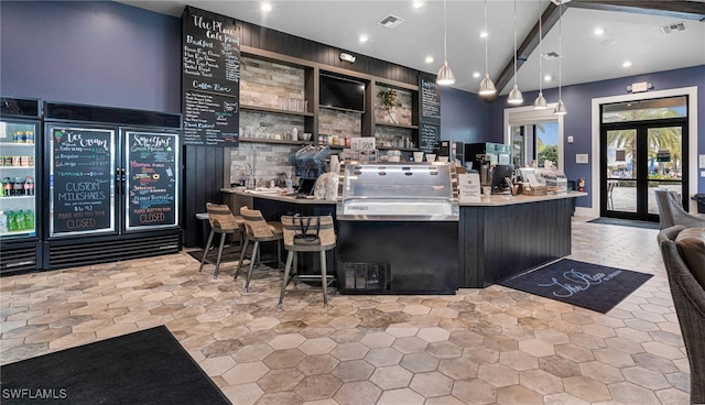 bar featuring decorative light fixtures and french doors