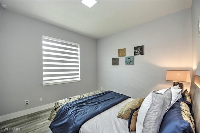 bedroom with light hardwood / wood-style floors