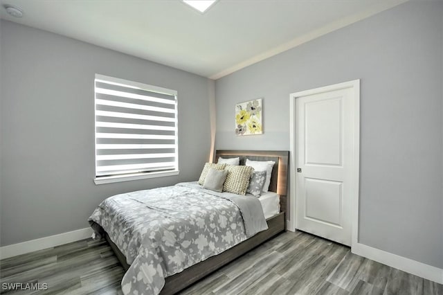 bedroom featuring hardwood / wood-style floors